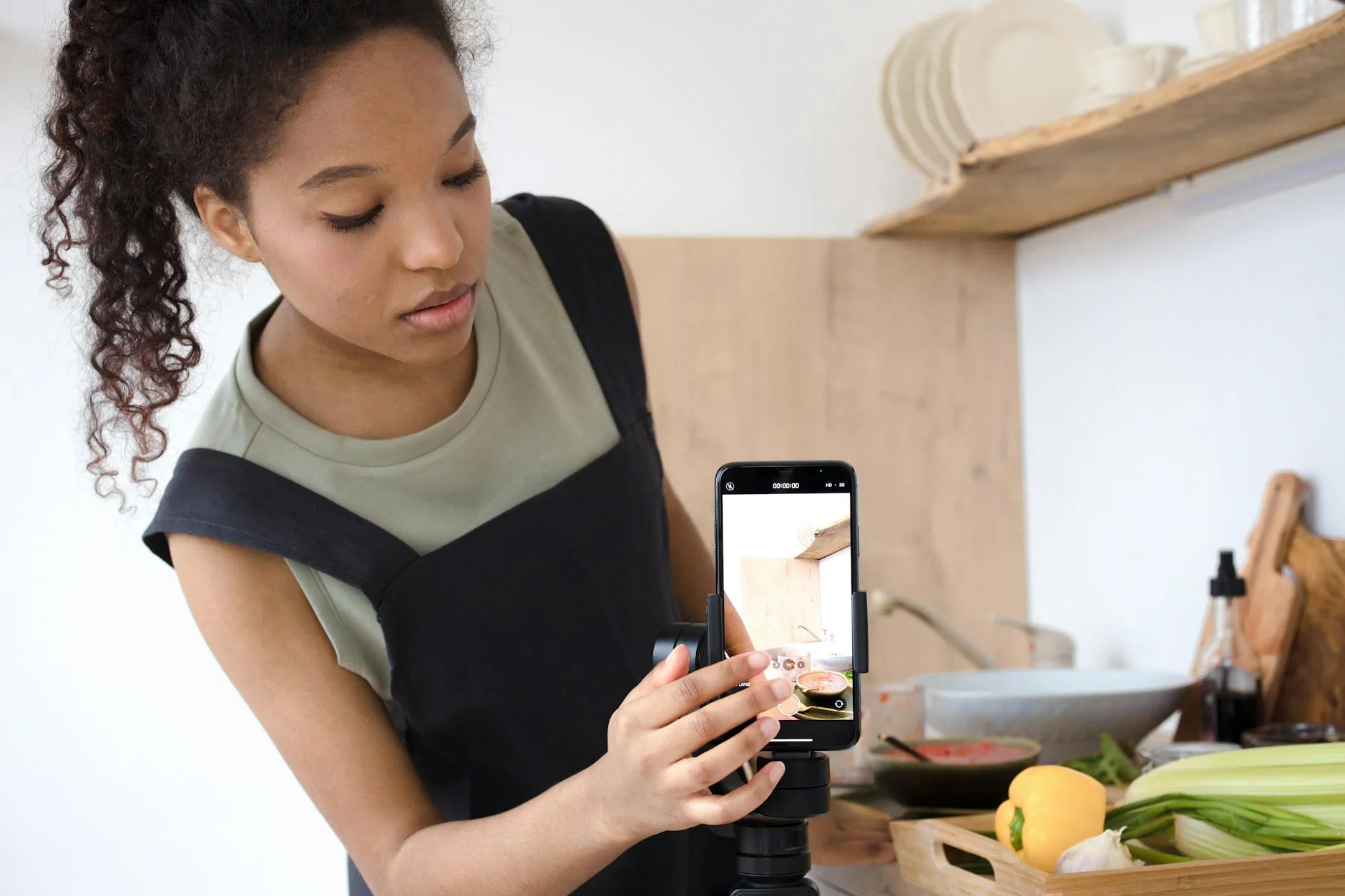 Girl taking a video of cooking