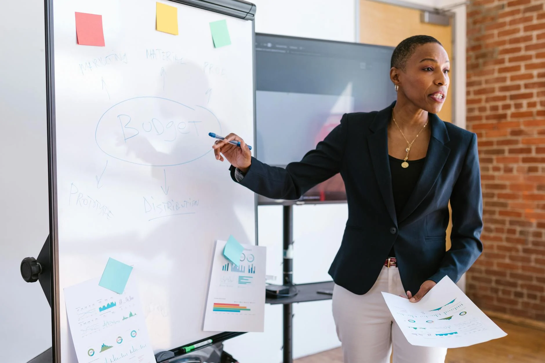 woman presenting using a whiteboard